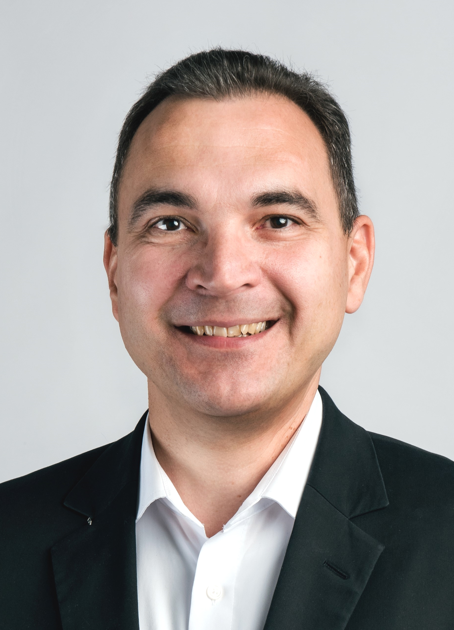Dr. Adrian Schuster
